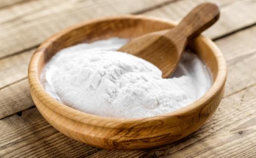 bowl of baking soda with a spoon