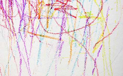 Colorful crayon on white wall