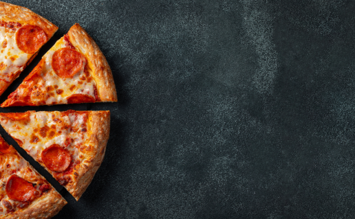 Pepperoni pizza on dark grey background