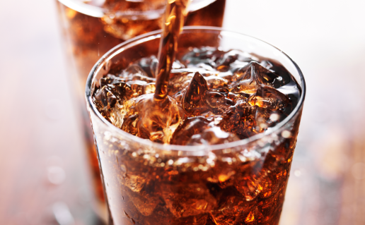 Cola pouring into glass