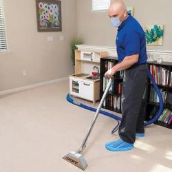 Technician Cleaning Carpet