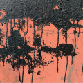 Dry tar stains on red surface
